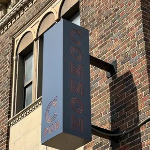 a sign on a brick building