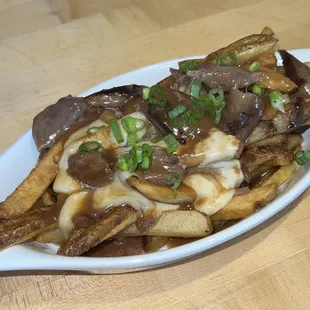 Poutine: Savory Lamb Gravy. Braised Lamb Shanks. Cheese Curds (special)
