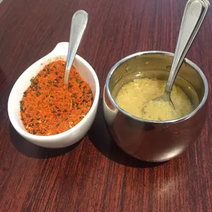 Condiments on each table to jazz up your ramen: togarashi (chili pepper) and garlic oil