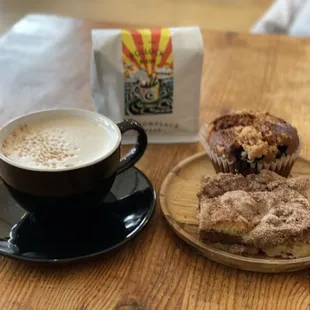 Chai tea, coffee cake, blueberry muffin, and some to go coffee beans