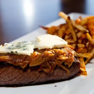 Prime Denver Steak, caramelized onion, blue cheese butter, house made fries