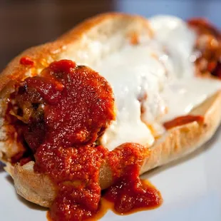 Meatball Sub, three meat grind, slow stewed meat sauce, fresh mozzarella, baguette