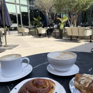 two plates of pastries and a cup of coffee
