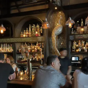 a group of people sitting at a bar