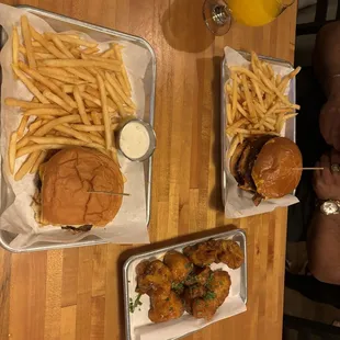 Classic smashburger on bottom. Chicken sandwich thing on top. Cauliflower wings on the side