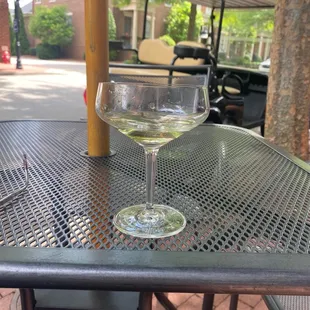 a glass of wine on a table