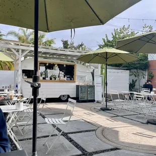 a food truck parked in a courtyard