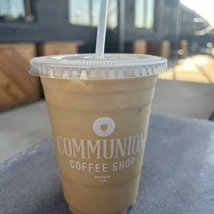 Iced Thai ginger latte with almond milk on the patio