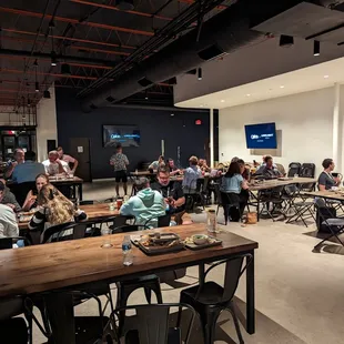 a group of people sitting at tables