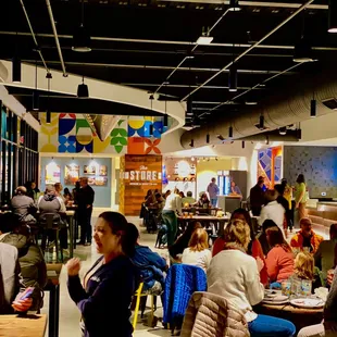 a large group of people sitting at tables
