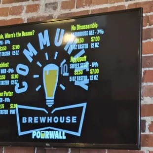 a sign on a brick wall