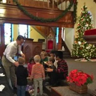 Pastor Jim with children during worship service