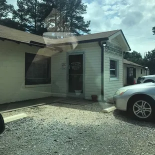 a white building with a cross on top