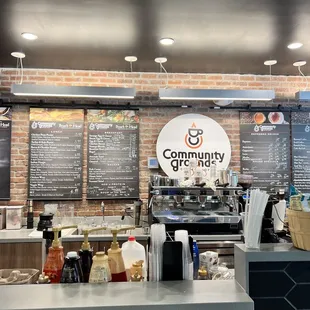 a coffee shop counter and menus