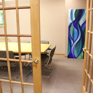 a conference room with a table and chairs