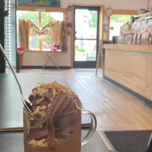 Chocolate oat based soft serve with toasted coconut on top