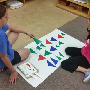 Students work with partners to use concrete materials to help with abstract concepts.