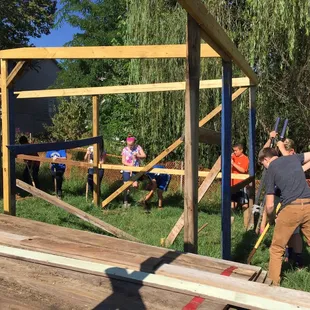 MMSK students getting practical life experience building a chicken coop