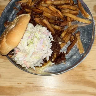 CoMo SlowMo - Brisket, Turkey, Pulled Pork topped with pickles and creamy coleslaw.