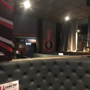 a view of the bar from the back of the booth