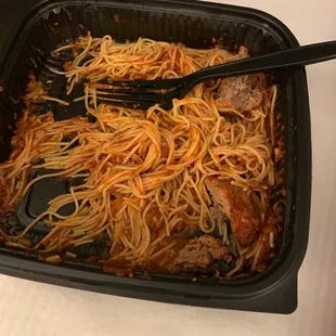 spaghetti and meat in a dish