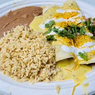 Smoked pulled pork enchiladas with rice and beans