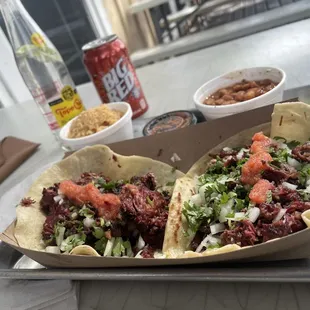 Smoked Barbacoa!! Absolutely amazing!! The beans and rice are some of the best I've ever had!!