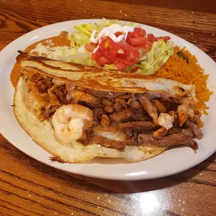 Massive quesadilla with chicken, steak and chicken