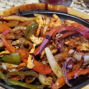 Fajitas with chicken and steak. It came with rice, beans and salad.