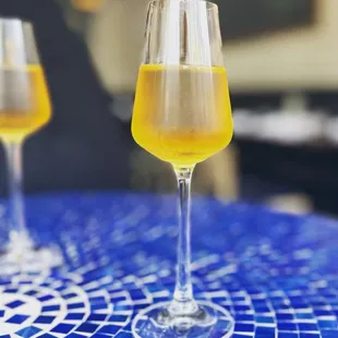 two glasses of wine on a table