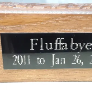 Urn with Fluffabye&apos;s name messed up and shoddy printing, and ***missing paw print*** that can never be made now.