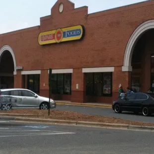 cars parked in front of a store
