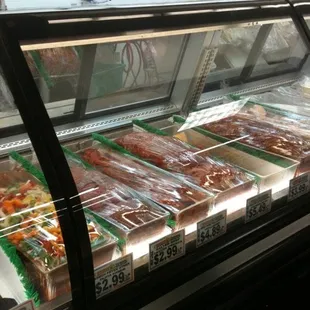 a variety of foods in a display case