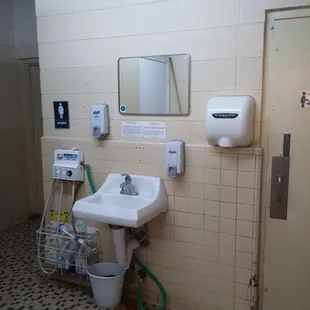 One of the stranger bathroom layouts. The sink is outside of the actual restroom.