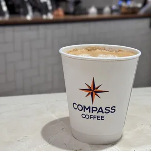 a cup of coffee on a counter