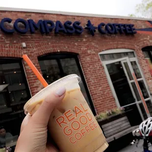 a person holding a cup of coffee
