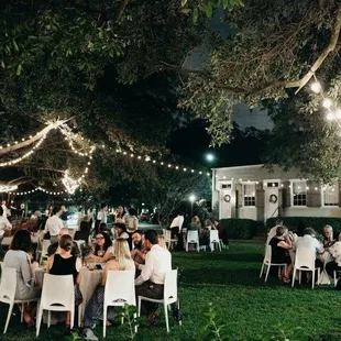 Outdoor corridor for guests to enjoy a dinner underneath the oaks during a reception or a place to party.