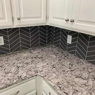 Cambria Quartz countertops with Chevron wall tile