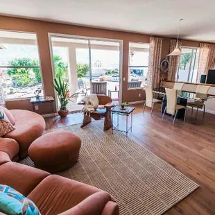 the living room and kitchen of a home