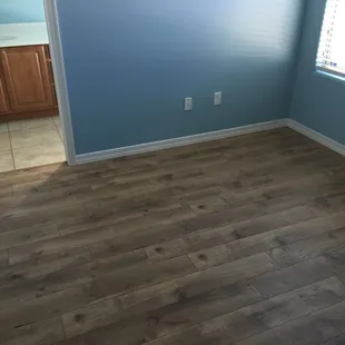 Complete Flooring&apos;s Century Oak laminate in a guest bedroom, replacing the old carpet in there.