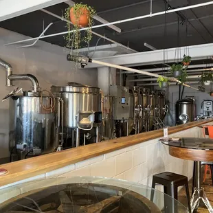 Other side of taproom with brewing room.