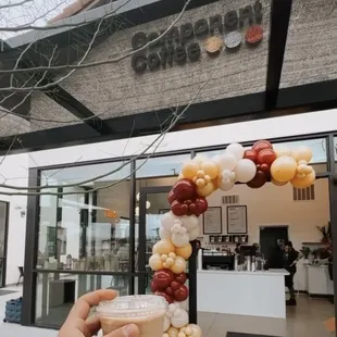 a person holding a cup of coffee