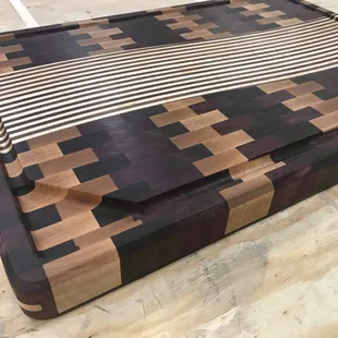 End grain cutting board with maple, walnut, cherry and purple heart