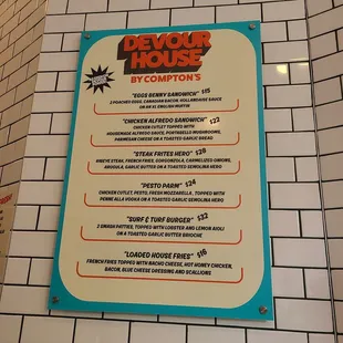 a sign on the wall of a restaurant