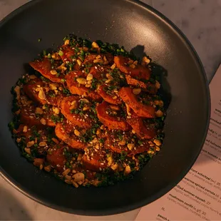 shawarma-spiced carrots (v) 

carrot purée, kale tabbouleh, pomegranate vinaigrette, peanut dukkah