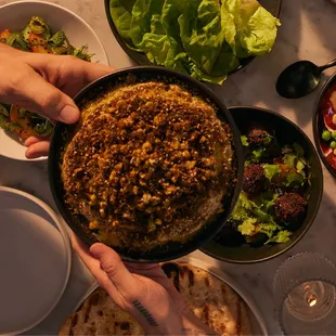 tahdig (v, gf)

crispy rice, amba tahina, grilled corn + jalapeño salad, za'atar, black lime