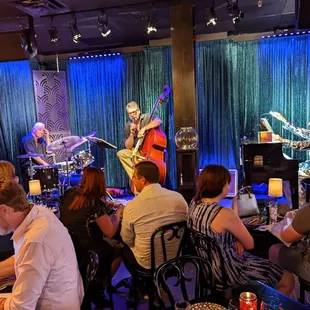a group of people sitting in a restaurant