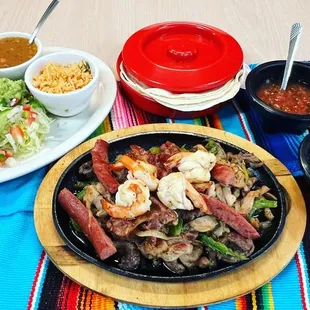 Parrillada, 2 jumbo shrimp, mixed beef and chicken fajita with country sausage and bacon