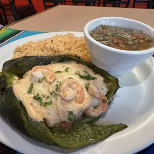 Chili relleno de camaron en crema de chipotle served with Spanish rice a side of lentejas.