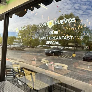 Outside window - senior discount on Monday/Wednesday, and early breakfast special $5.99